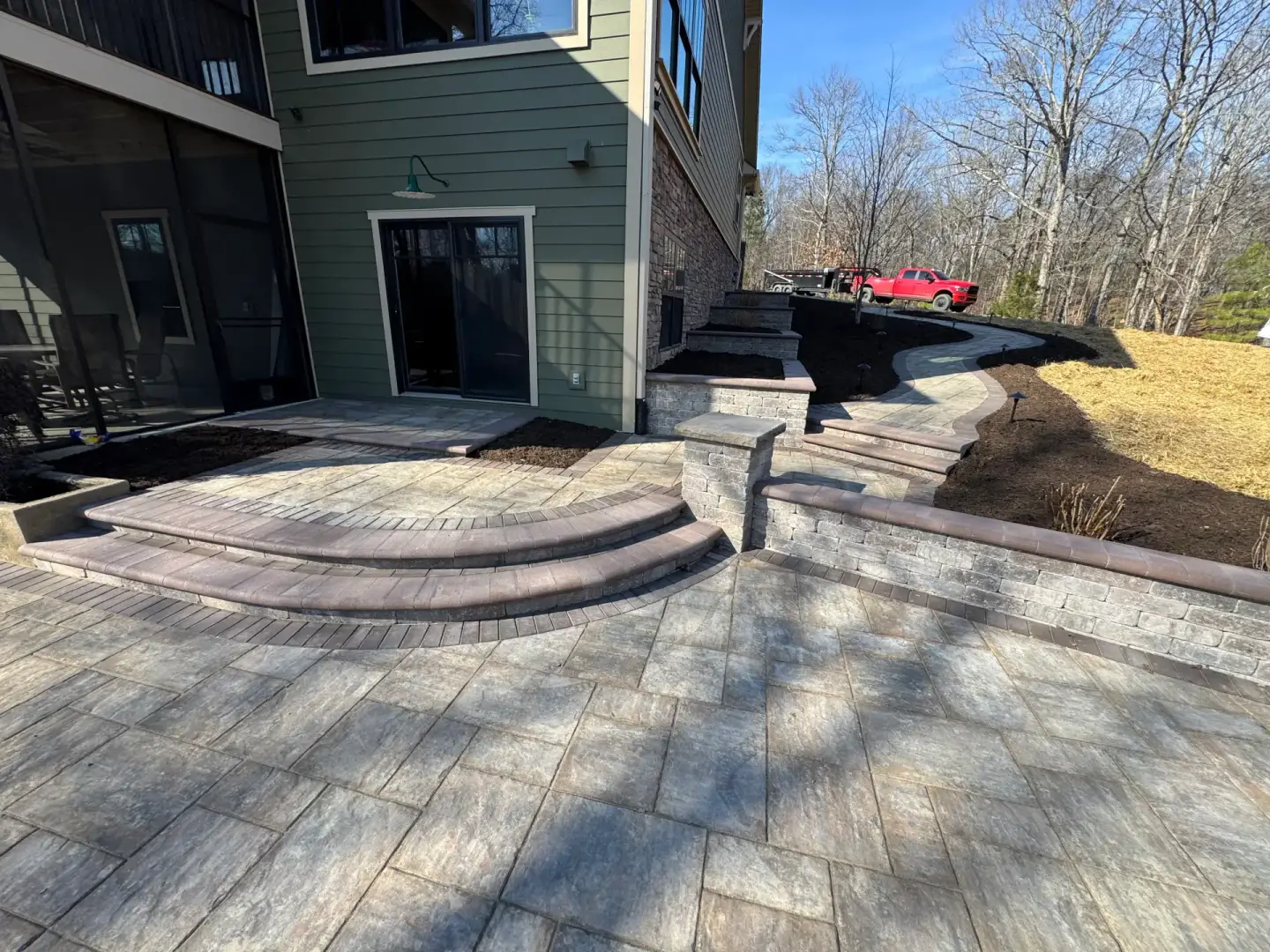 Completed retaining wall, paver steps, and walkway project
