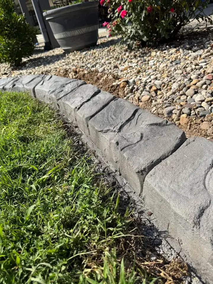 Close detail of a formed concrete landscape edge.